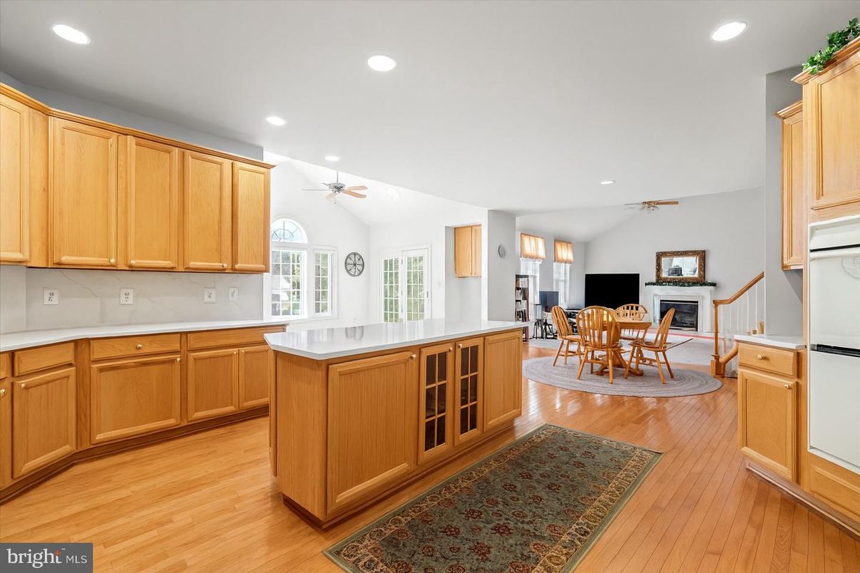Dining room, Fireplace, Interior, Kitchen, Recessed Lighting, Wood Texture Flooring