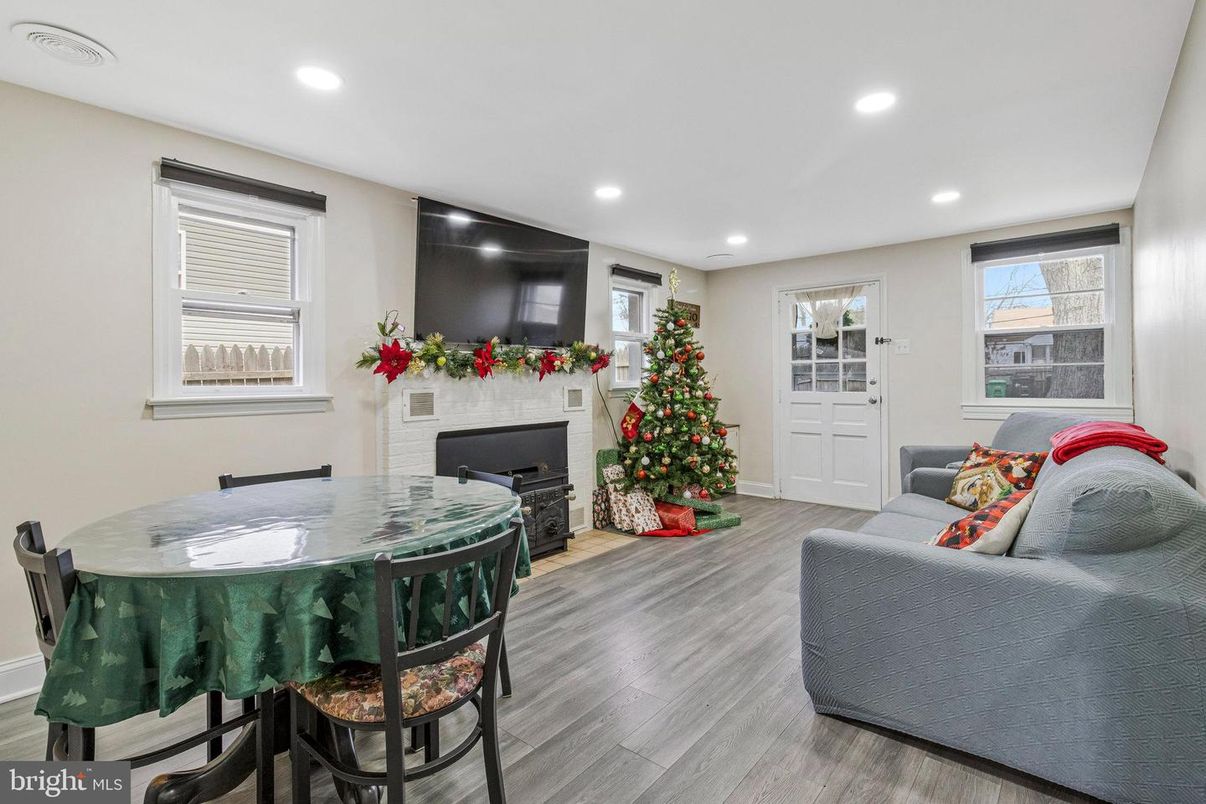 Dining room, Fireplace, Interior, Living room, Recessed Lighting, Wood Texture Flooring