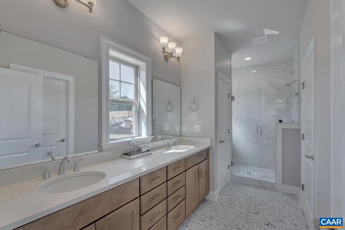 Bathroom, Dual Sink Vanities, Glass Shower, Interior, Marble, Marble Walls, Recessed Lighting