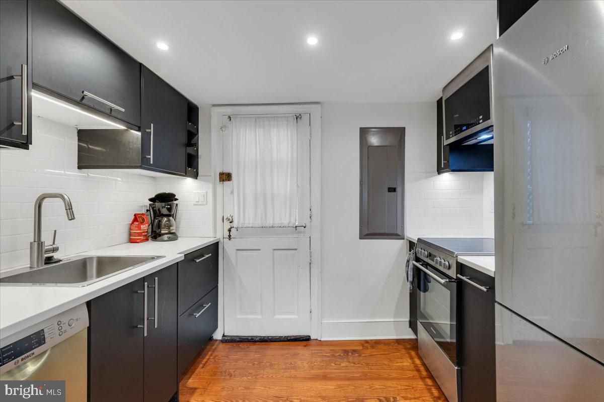 Interior, Kitchen, Recessed Lighting, Stainless Steel Appliances, Wood Texture Flooring