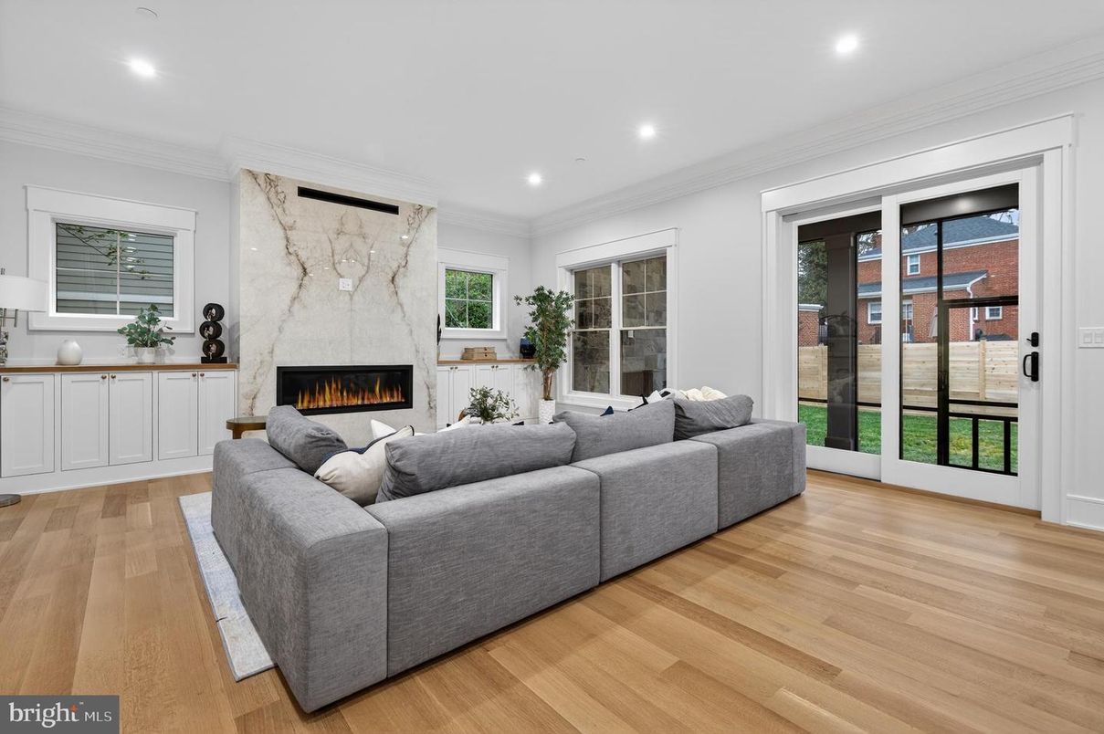 Fireplace, Interior, Living room, Marble Walls, Recessed Lighting, Wood Texture Flooring