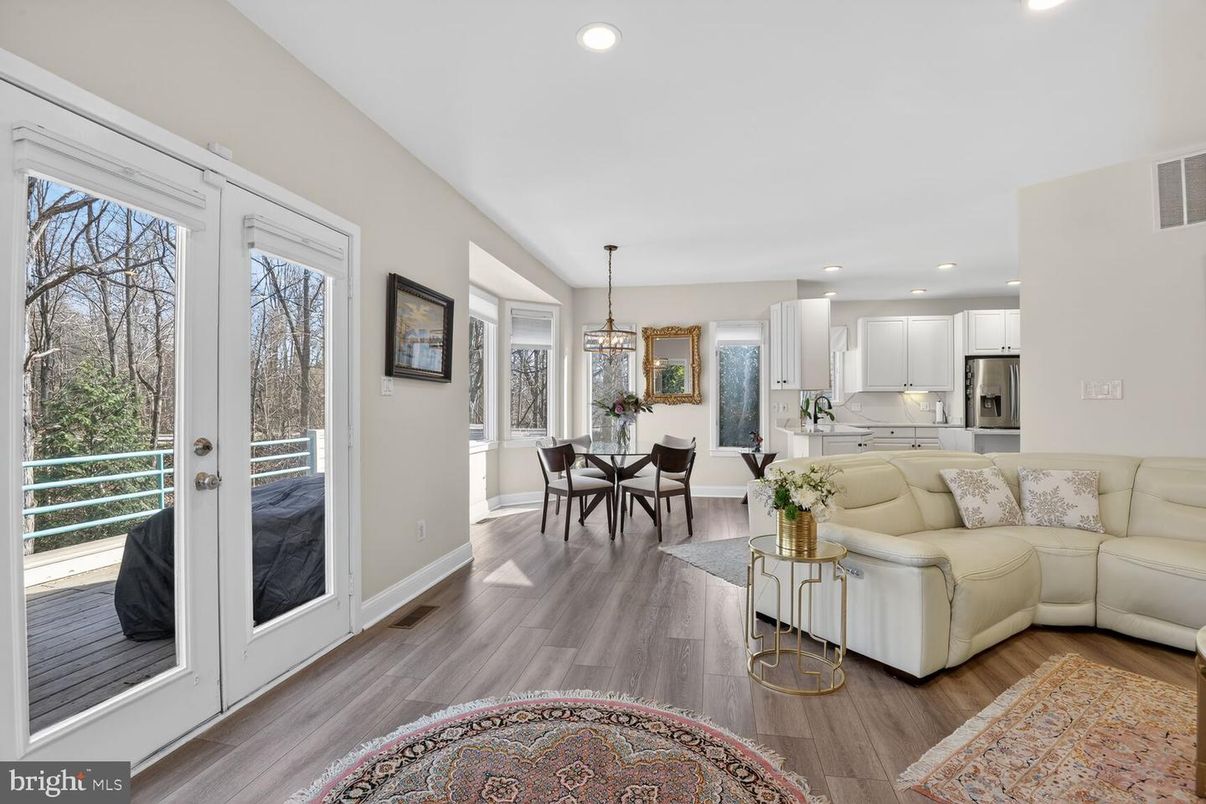 Chandelier, Dining room, Interior, Kitchen, Living room, Pendant Lights, Recessed Lighting, Stainless Steel Appliances, Wood Texture Flooring