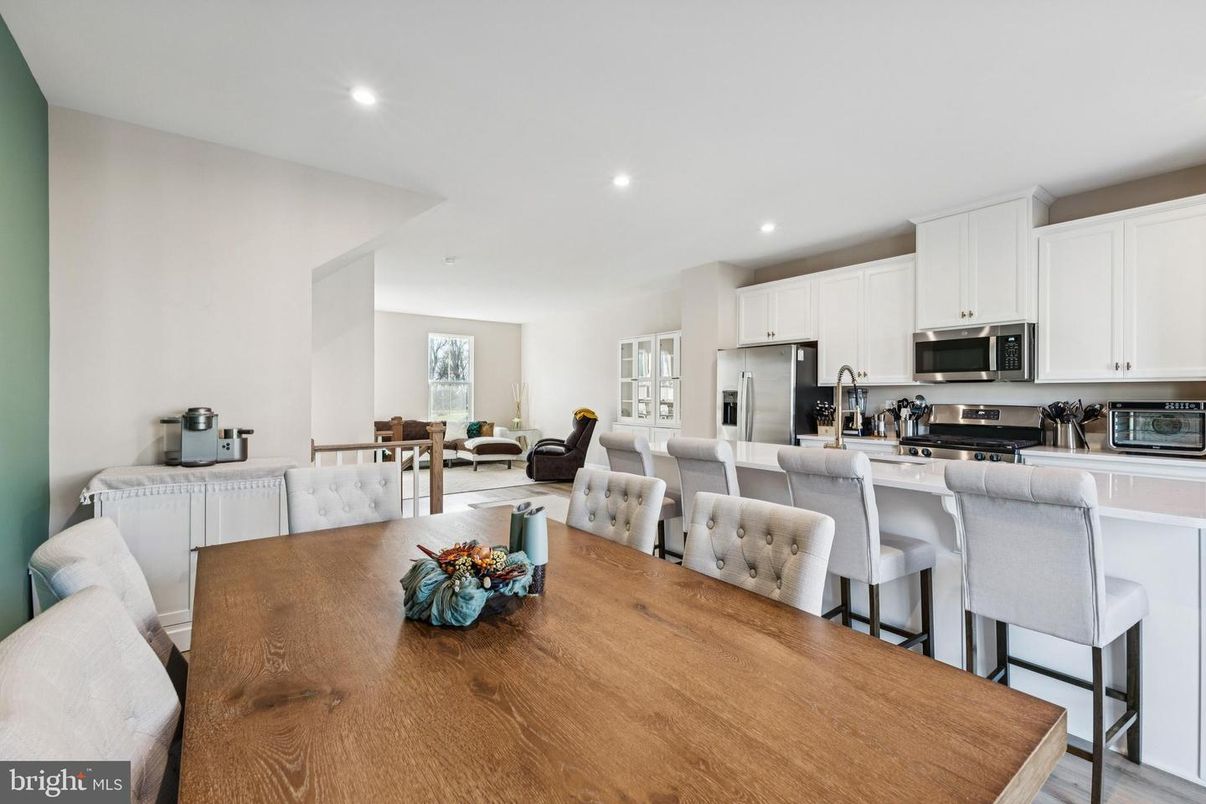 Dining room, Interior, Kitchen, Living room, Recessed Lighting, Stainless Steel Appliances, Wood Texture Flooring