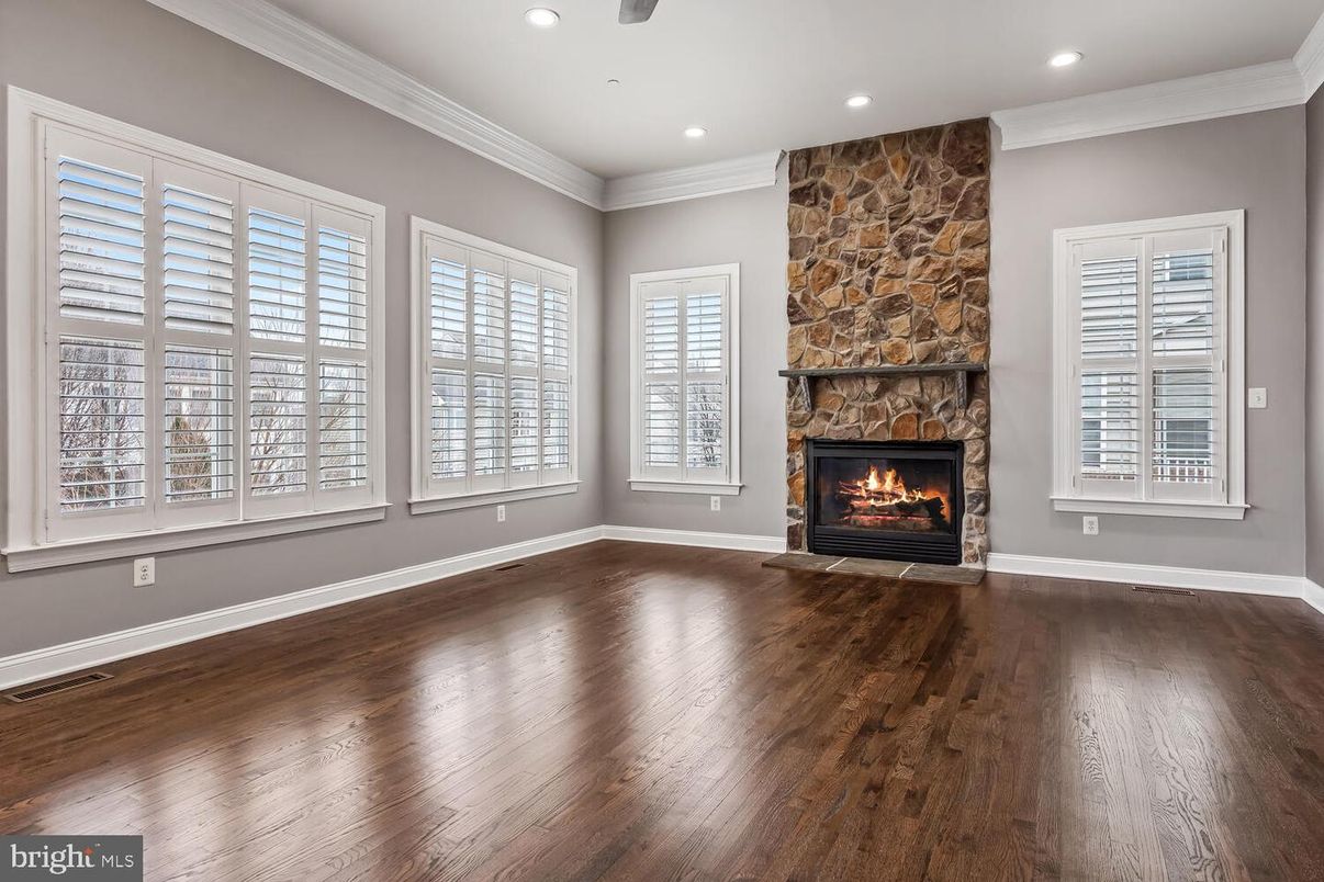 Empty room, Fireplace, Interior, Recessed Lighting, Stone Walls, Wood Texture Flooring