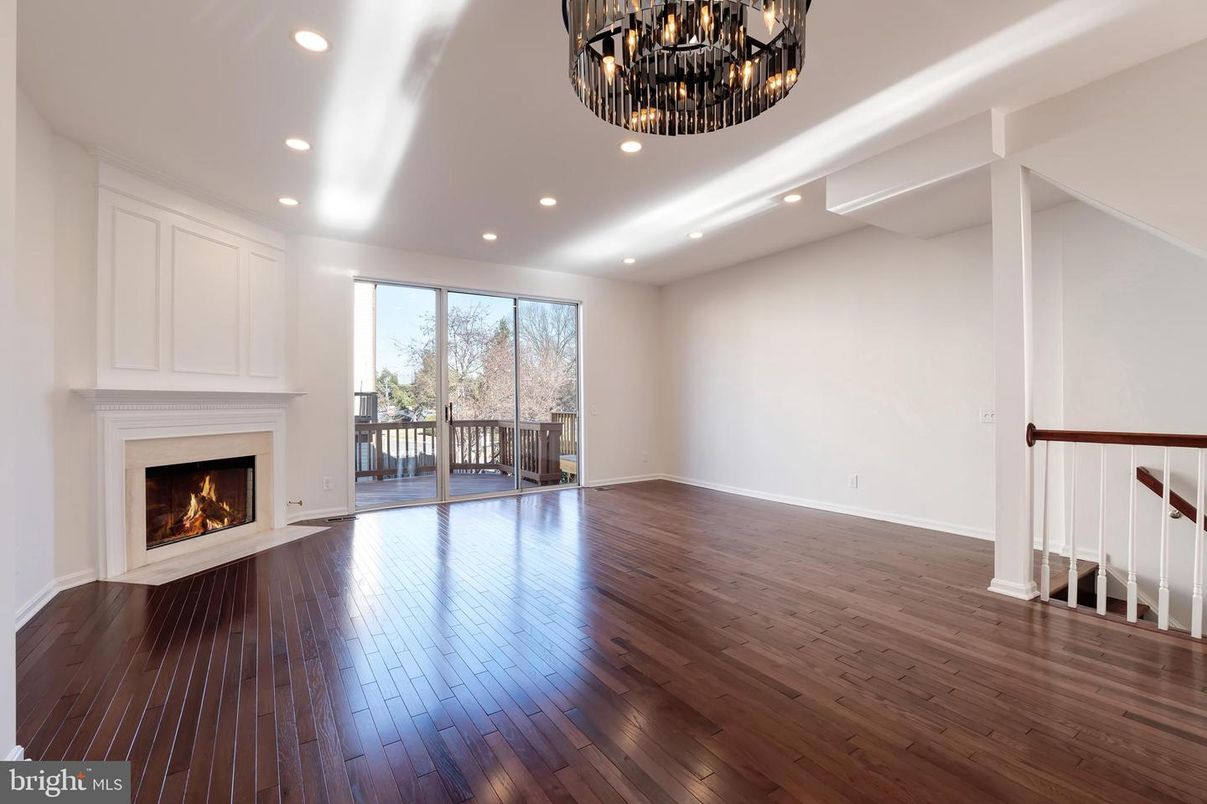 Chandelier, Empty room, Fireplace, Interior, Recessed Lighting, Wood Texture Flooring