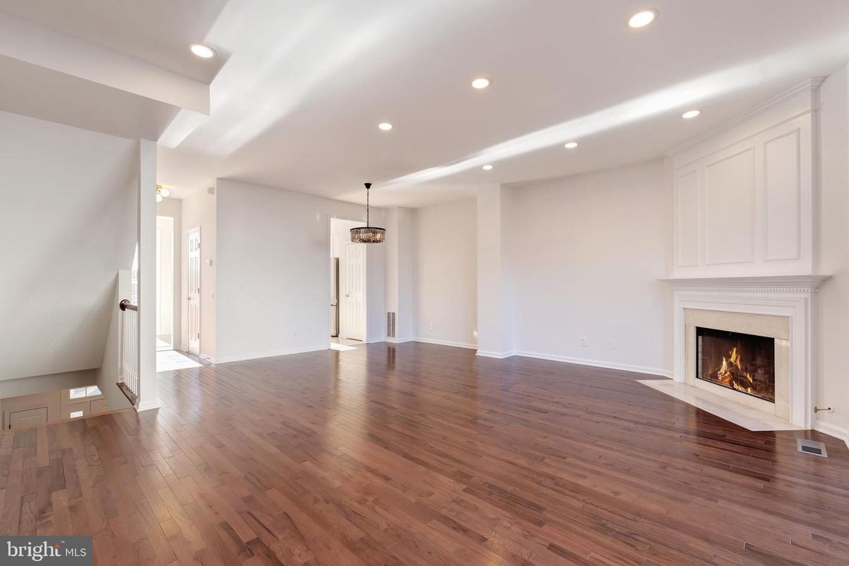 Empty room, Fireplace, Interior, Pendant Lights, Recessed Lighting, Wood Texture Flooring
