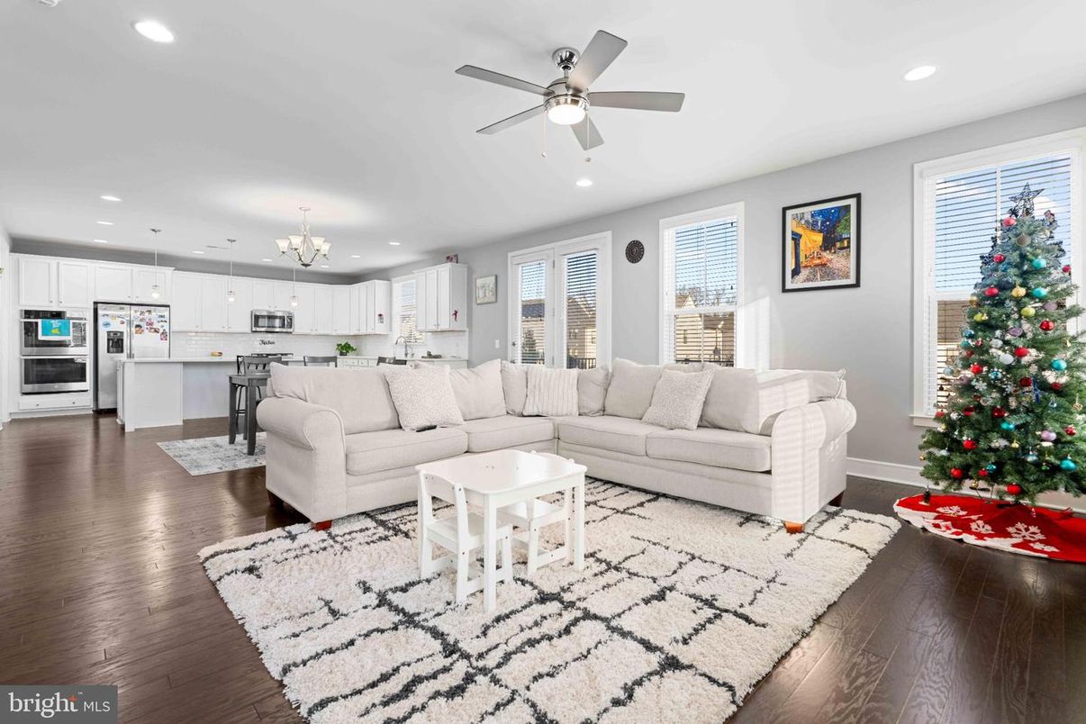 Chandelier, Interior, Kitchen, Living room, Pendant Lights, Recessed Lighting, Stainless Steel Appliances, Wood Texture Flooring