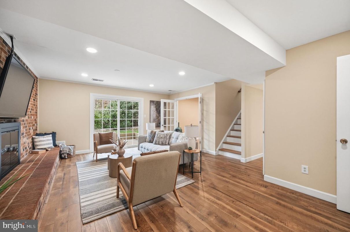 Fireplace, Interior, Living room, Recessed Lighting, Stone Walls, Wood Texture Flooring