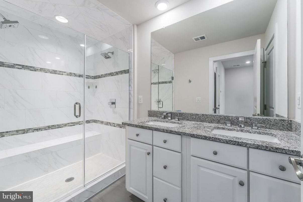 Bathroom, Dual Sink Vanities, Glass Shower, Interior, Marble Walls, Recessed Lighting