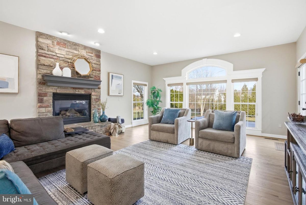 Fireplace, Interior, Living room, Recessed Lighting, Stone Walls, Wood Texture Flooring