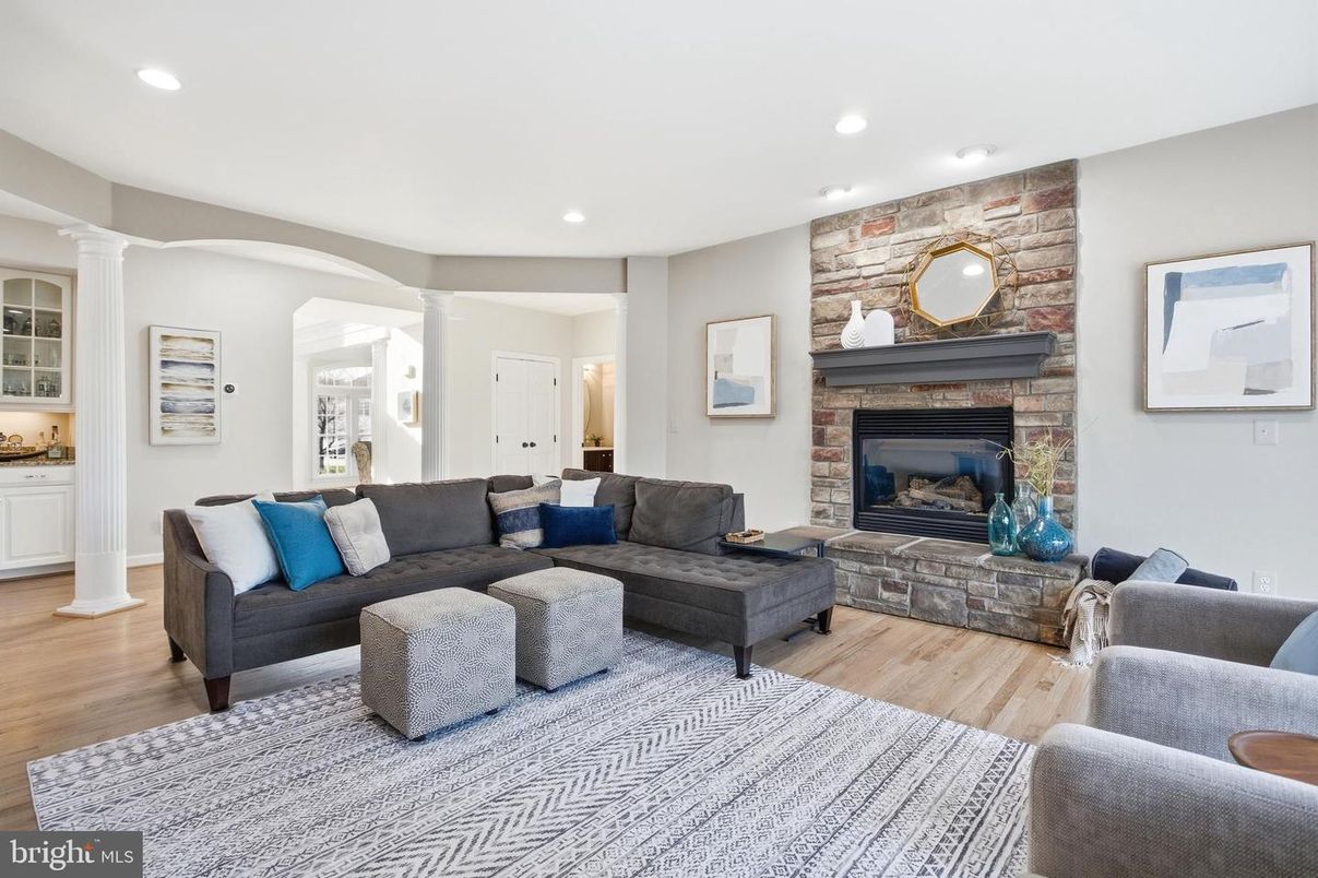 Fireplace, Interior, Living room, Recessed Lighting, Stone Walls, Wood Texture Flooring