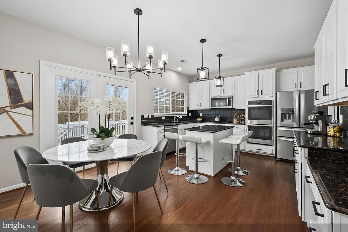 Dining room, Interior, Kitchen, Pendant Lights, Recessed Lighting, Stainless Steel Appliances, Wood Texture Flooring
