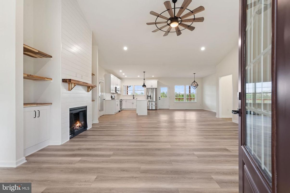 Empty room, Fireplace, Interior, Kitchen, Pendant Lights, Recessed Lighting, Wood Texture Flooring