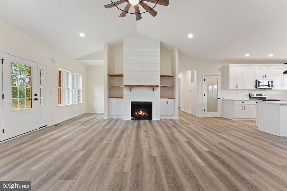 Empty room, Fireplace, Interior, Kitchen, Recessed Lighting, Wood Texture Flooring