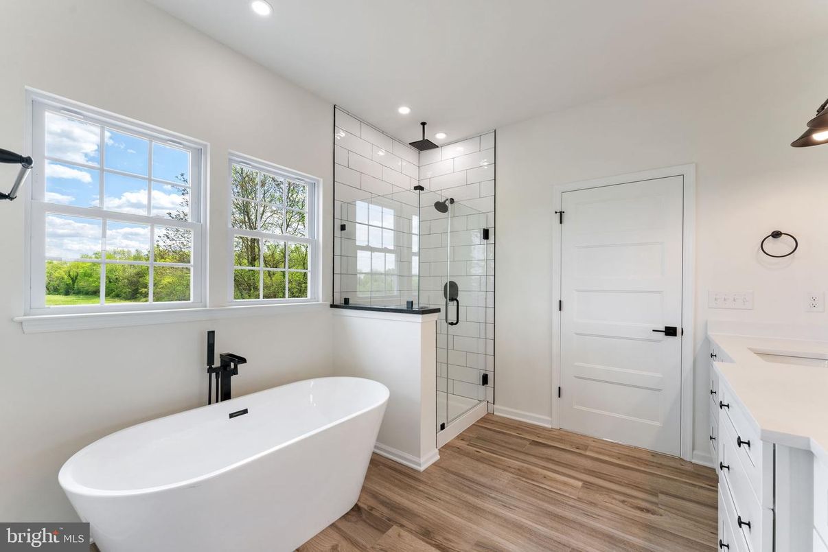 Bathroom, Dual Sink Vanities, Free Standing Baths, Glass Shower, Interior, Recessed Lighting, Wood Texture Flooring