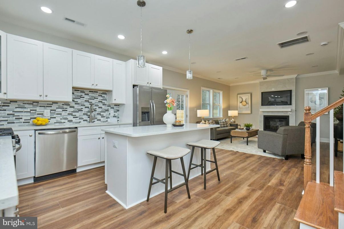 Fireplace, Interior, Kitchen, Living room, Pendant Lights, Recessed Lighting, Stainless Steel Appliances, Wood Texture Flooring