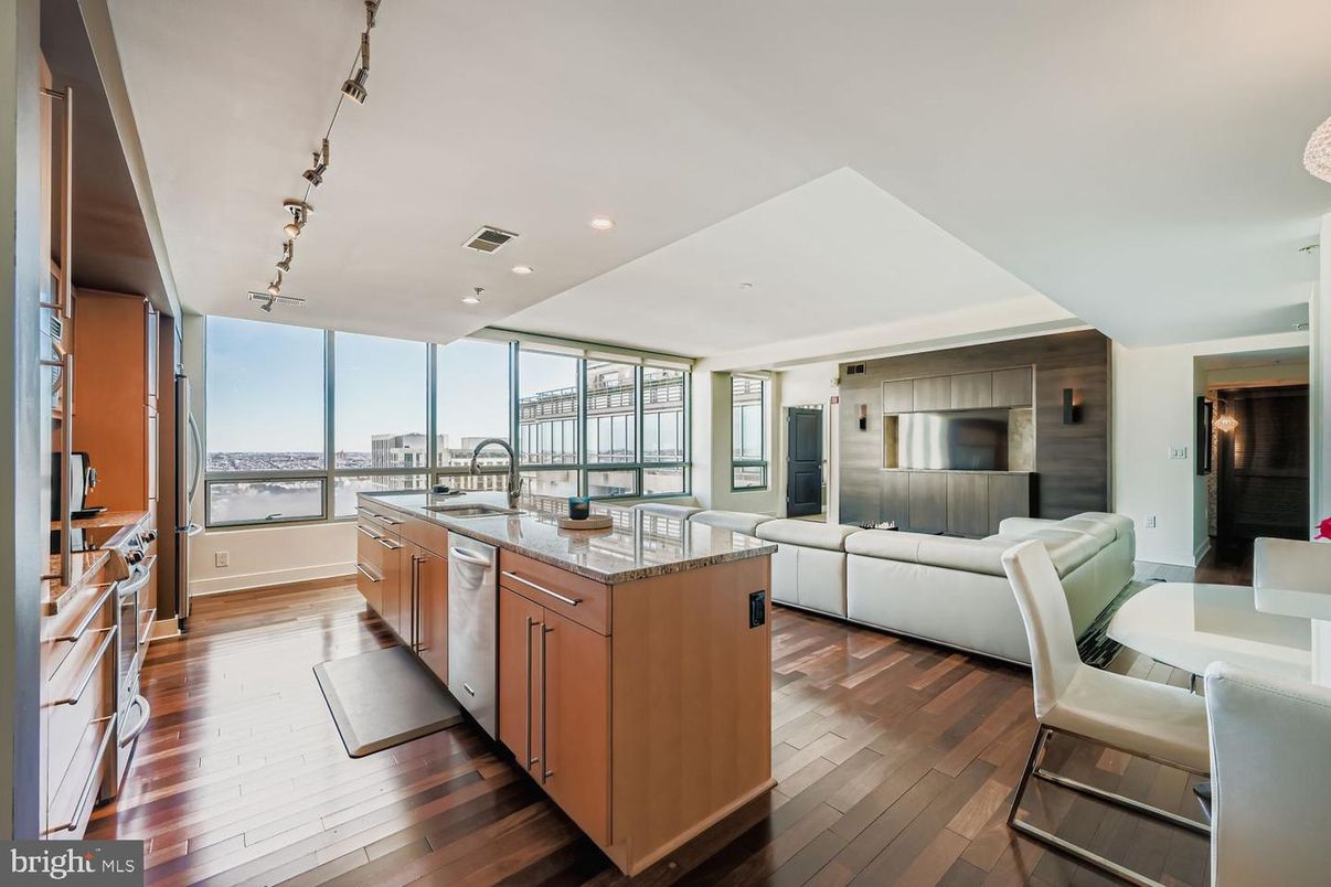 Dining room, Interior, Kitchen, Living room, Recessed Lighting, Stainless Steel Appliances, Water, Wood Texture Flooring