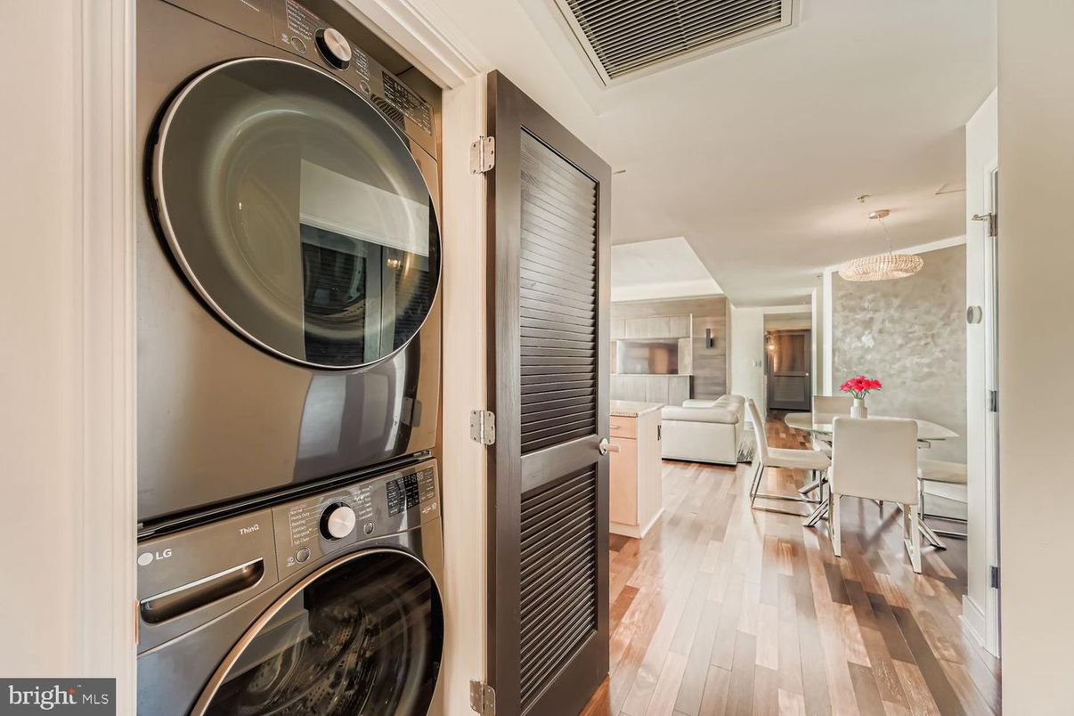 Chandelier, Dining room, Fireplace, Interior, Living room, Pendant Lights, Utility Closets, Washer, Wood Texture Flooring