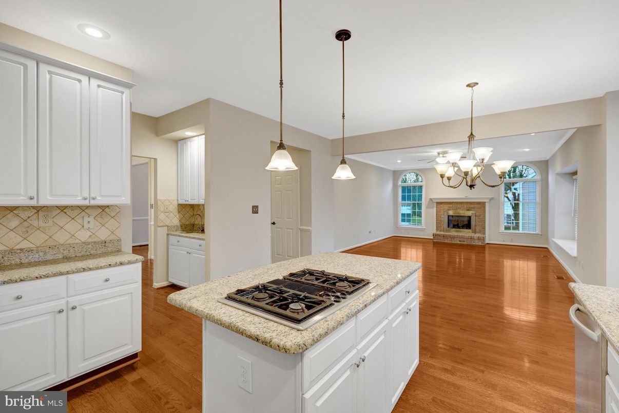 Chandelier, Fireplace, Interior, Kitchen, Pendant Lights, Recessed Lighting, Wood Texture Flooring