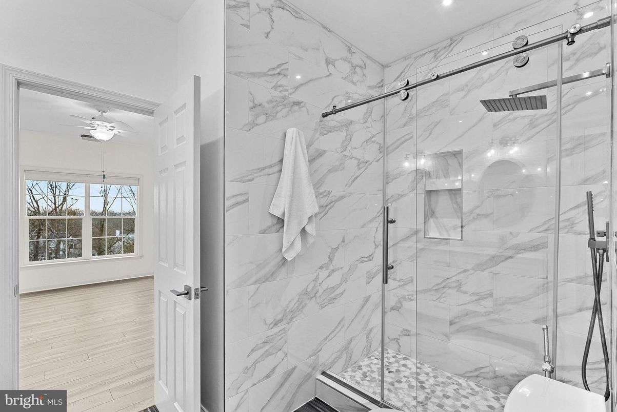 Bathroom, Glass Shower, Interior, Marble Walls, Recessed Lighting, Wood Texture Flooring
