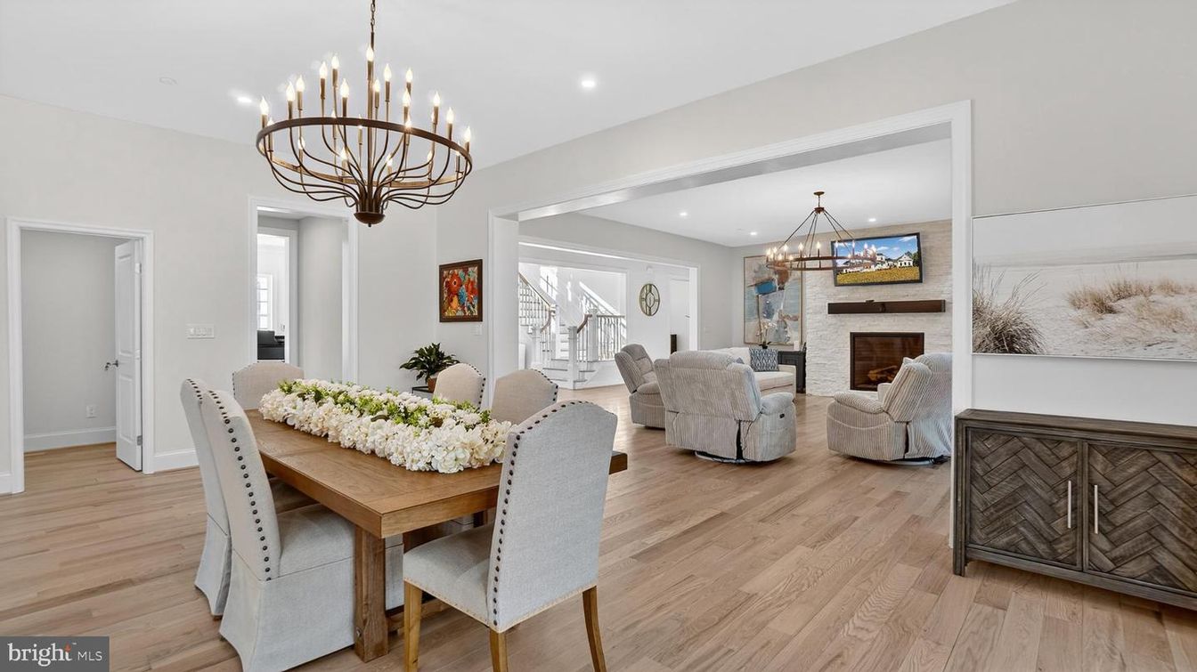 Chandelier, Dining room, Fireplace, Interior, Living room, Pendant Lights, Recessed Lighting, Wood Texture Flooring