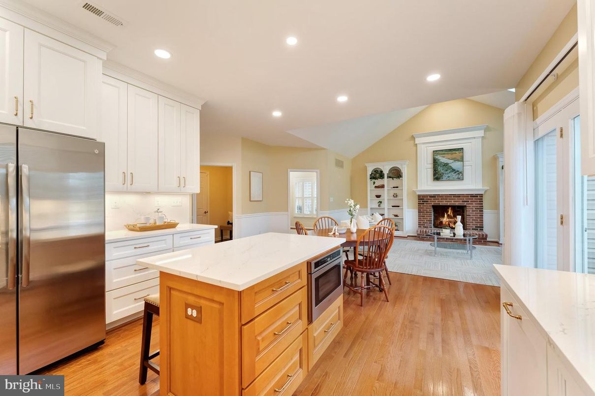 Dining room, Fireplace, Interior, Kitchen, Recessed Lighting, Stainless Steel Appliances, Wood Texture Flooring