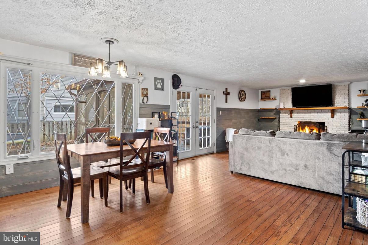 Dining room, Fireplace, Interior, Living room, Pendant Lights, Stone Walls, Wood Texture Flooring