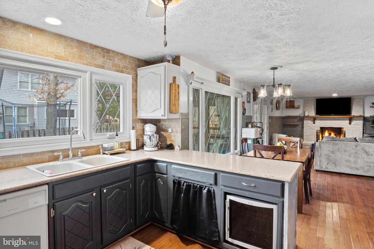 Fireplace, Interior, Kitchen, Living room, Pendant Lights, Recessed Lighting, Stone Walls, Wood Texture Flooring