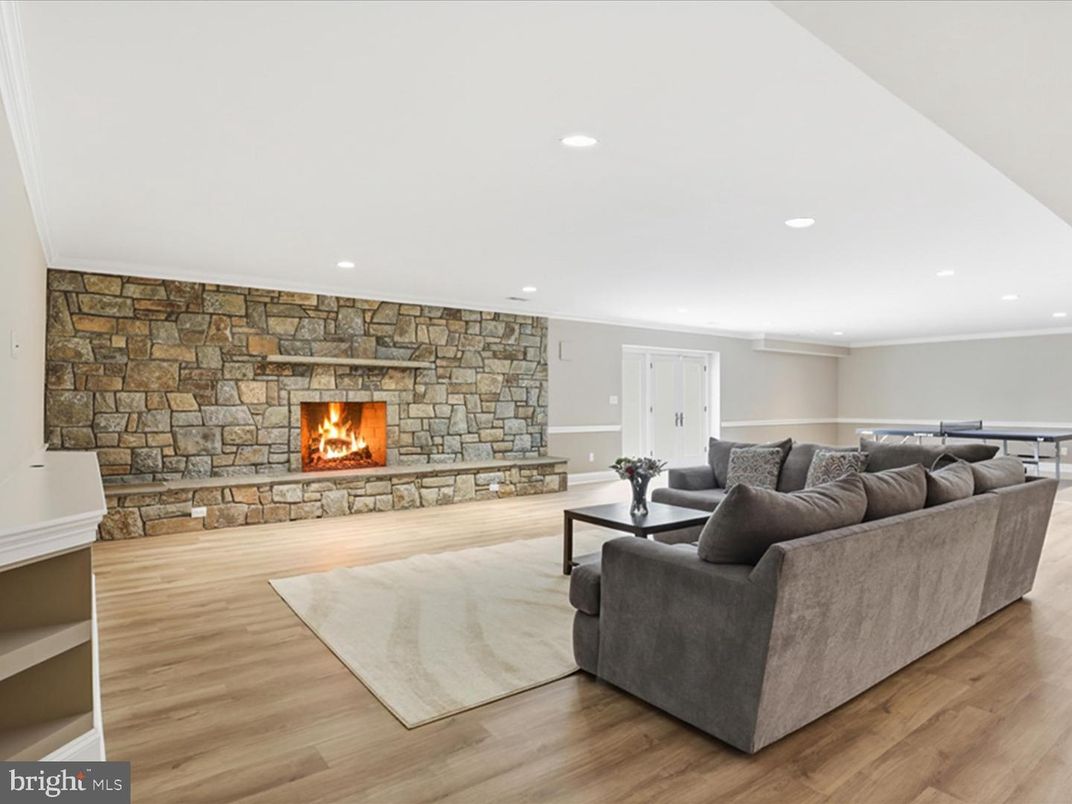 Fireplace, Interior, Living room, Recessed Lighting, Stone Walls, Wood Texture Flooring