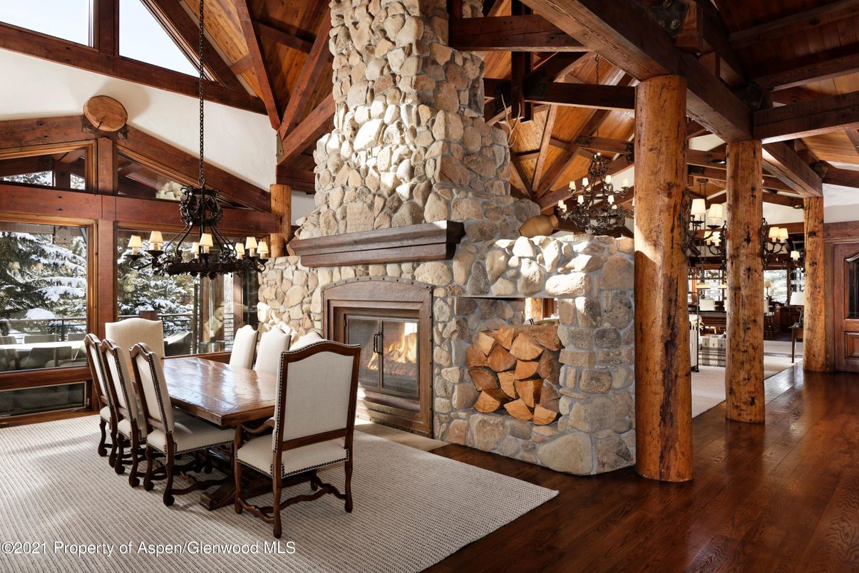 Chandelier, Dining room, Fireplace, Interior, Pendant Lights, Stone Walls, Wooden Beams, Wooden Ceilings, Wood Texture Flooring