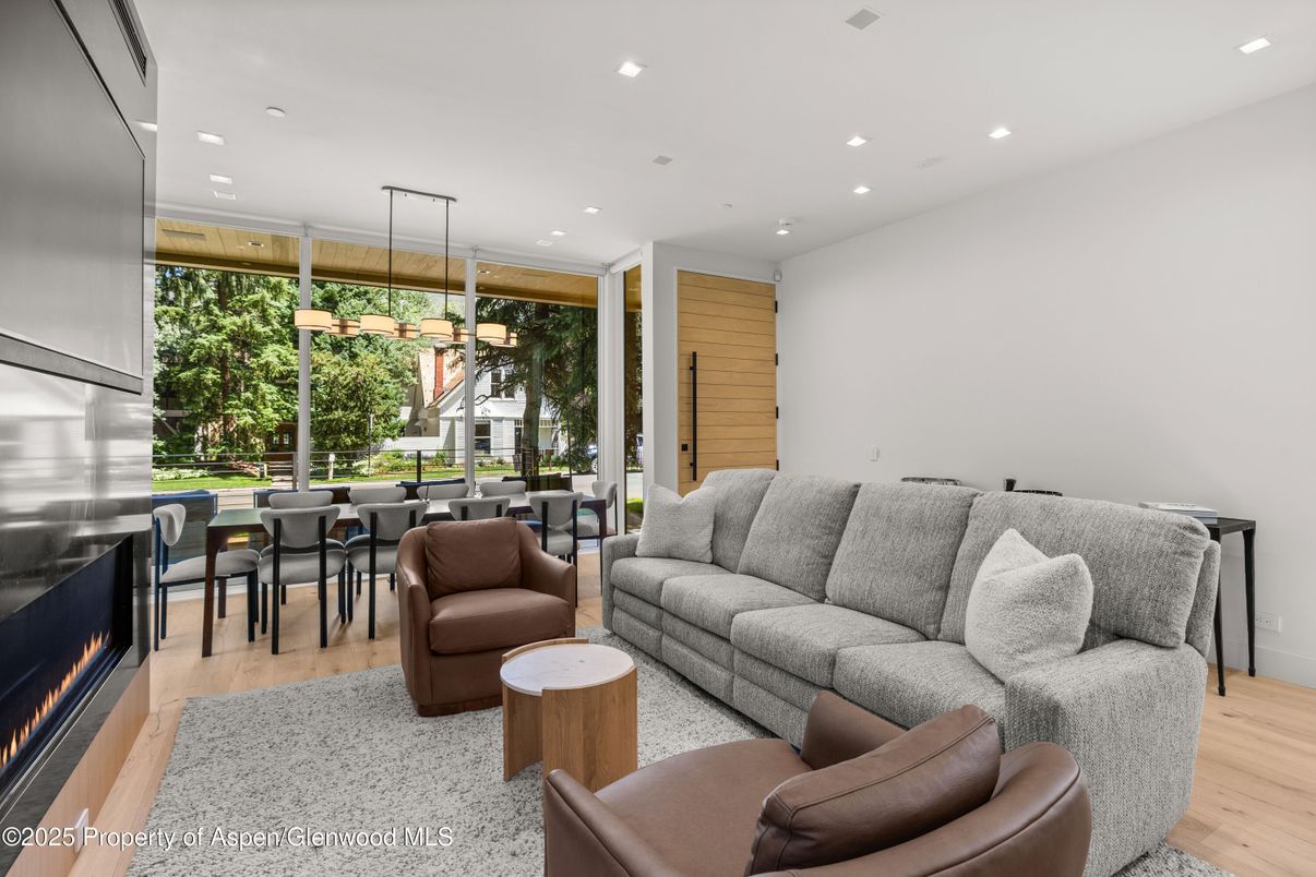 Dining room, Fireplace, Interior, Living room, Pendant Lights, Recessed Lighting, Wood Texture Flooring, Wooden Walls