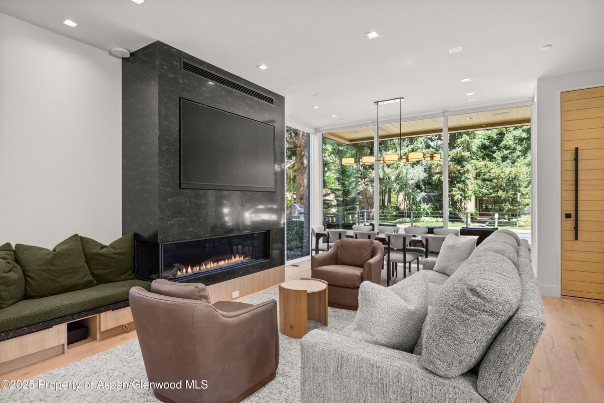 Dining room, Fireplace, Interior, Living room, Pendant Lights, Recessed Lighting, Wood Texture Flooring