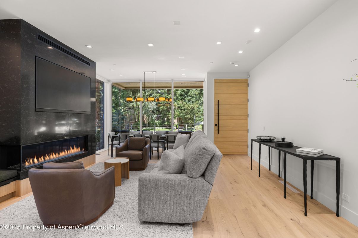 Dining room, Fireplace, Interior, Living room, Pendant Lights, Recessed Lighting, Wood Texture Flooring