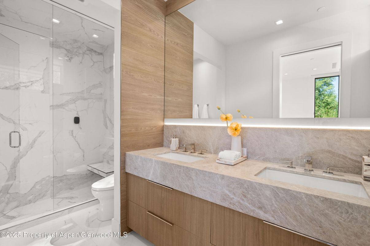 Bathroom, Dual Sink Vanities, Glass Shower, Interior, Marble, Marble Walls, Recessed Lighting