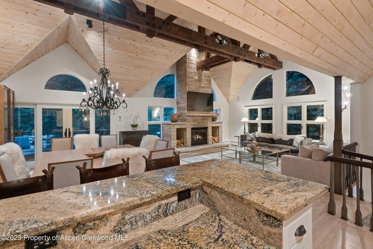Chandelier, Fireplace, Interior, Living room, Stone Walls, Wooden Beams, Wooden Ceilings