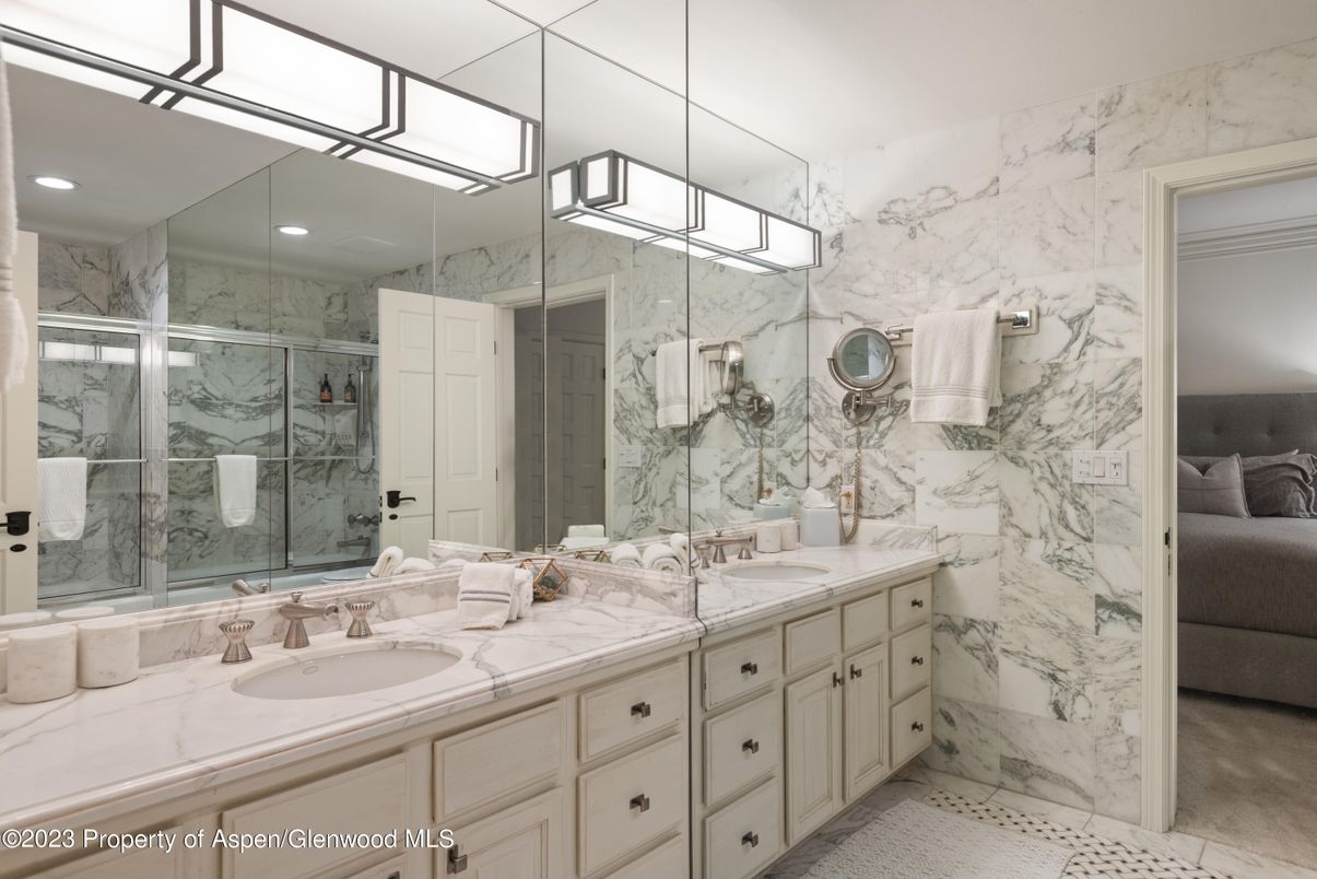 Bathroom, Dual Sink Vanities, Glass Shower, Interior, Marble Walls, Recessed Lighting