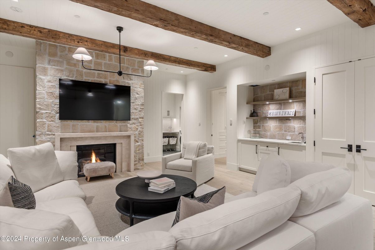 Fireplace, Interior, Living room, Pendant Lights, Recessed Lighting, Stone Walls, Wooden Beams, Wood Texture Flooring
