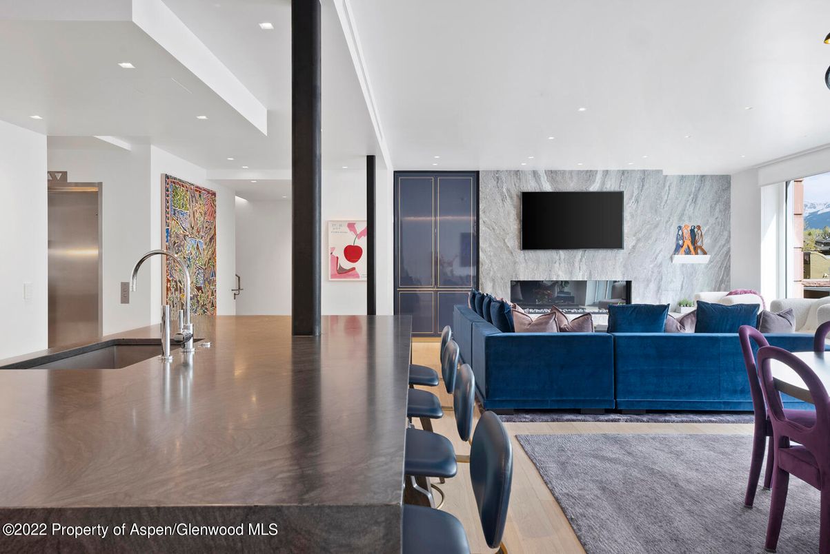 Fireplace, Interior, Living room, Marble Walls, Recessed Lighting, Wood Texture Flooring