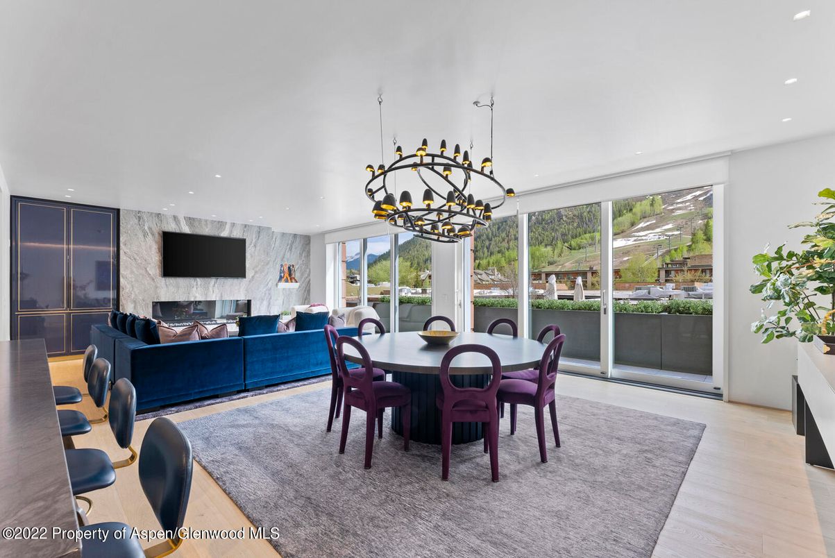 Dining room, Fireplace, Interior, Living room, Marble Walls, Pendant Lights, Recessed Lighting, Wood Texture Flooring