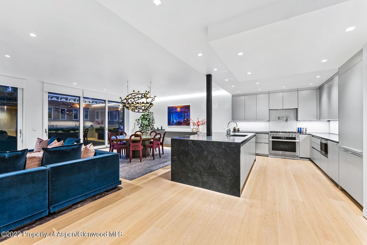 Chandelier, Dining room, Interior, Kitchen, Living room, Pendant Lights, Recessed Lighting, Stainless Steel Appliances, Wood Texture Flooring