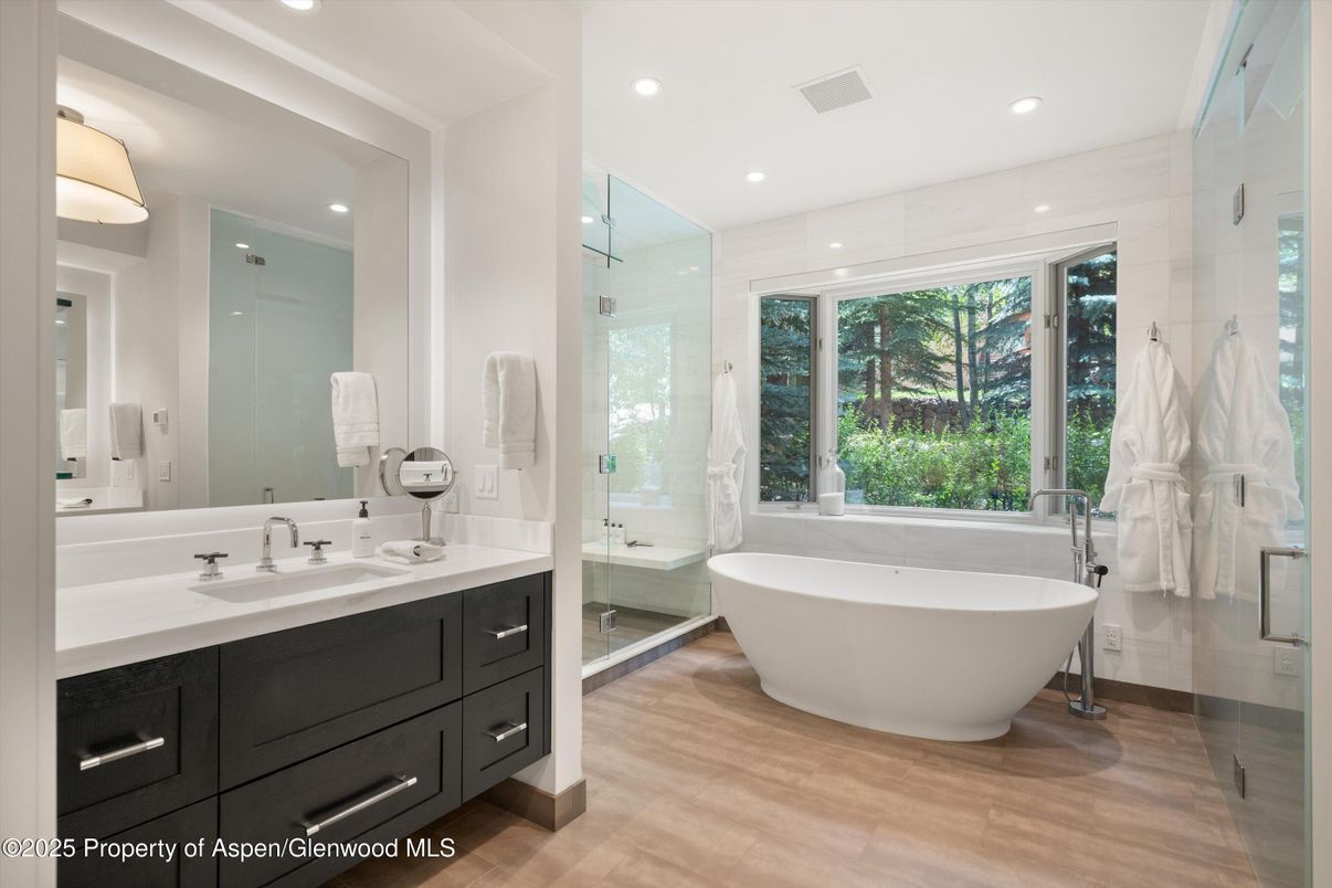 Bathroom, Free Standing Baths, Glass Shower, Interior, Recessed Lighting, Wood Texture Flooring