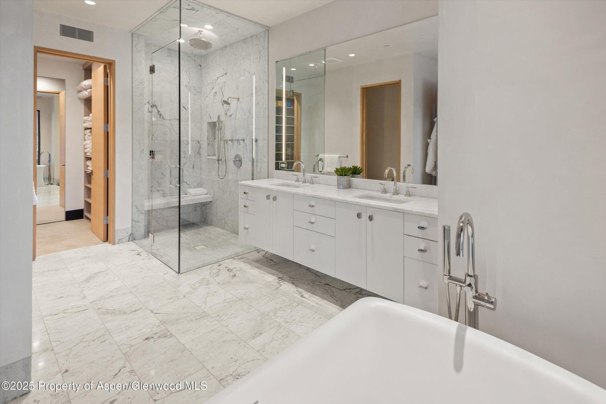 Bathroom, Dual Sink Vanities, Glass Shower, Interior, Marble, Marble Walls, Recessed Lighting