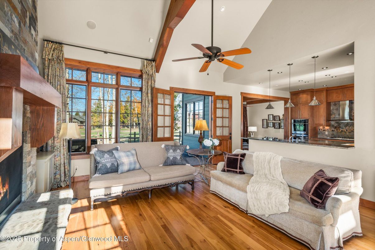 Fireplace, Interior, Kitchen, Living room, Pendant Lights, Recessed Lighting, Stainless Steel Appliances, Wood Texture Flooring