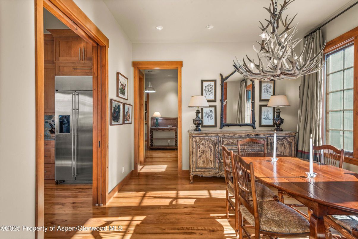 Chandelier, Dining room, Interior, Recessed Lighting, Stainless Steel Appliances, Wood Texture Flooring