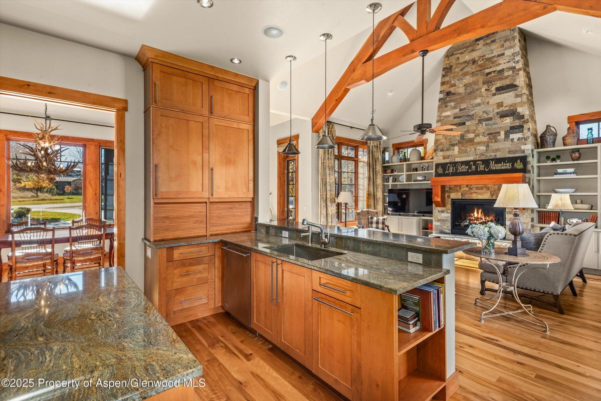 Dining room, Fireplace, Interior, Kitchen, Living room, Pendant Lights, Recessed Lighting, Stone Walls, Wooden Beams, Wood Texture Flooring