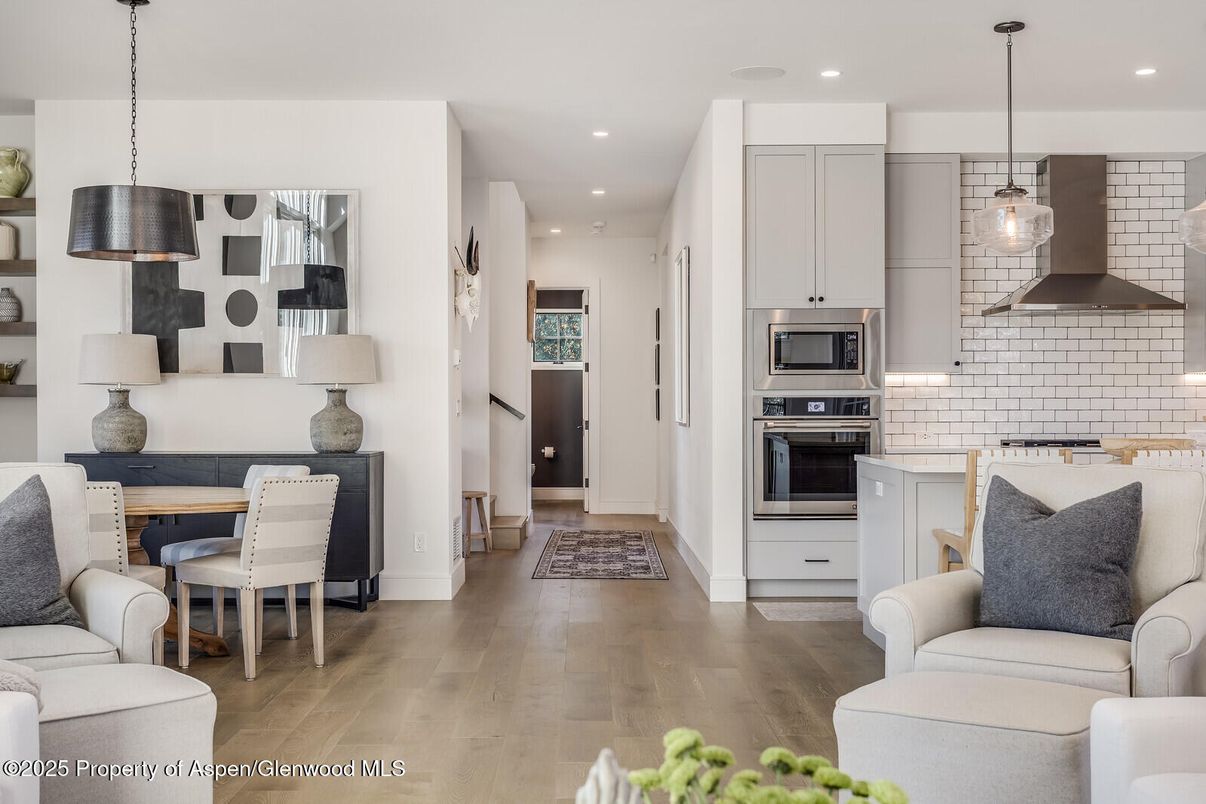 Dining room, Interior, Kitchen, Living room, Pendant Lights, Recessed Lighting, Stainless Steel Appliances, Wood Texture Flooring