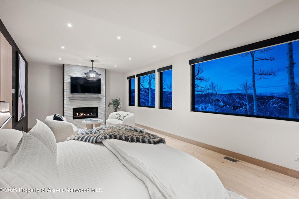 Bedroom, Fireplace, Interior, Pendant Lights, Recessed Lighting, Wood Texture Flooring