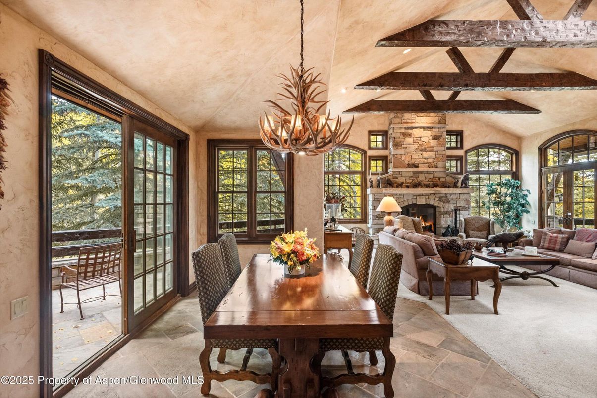Chandelier, Dining room, Fireplace, Interior, Living room, Stone Walls, Wooden Beams