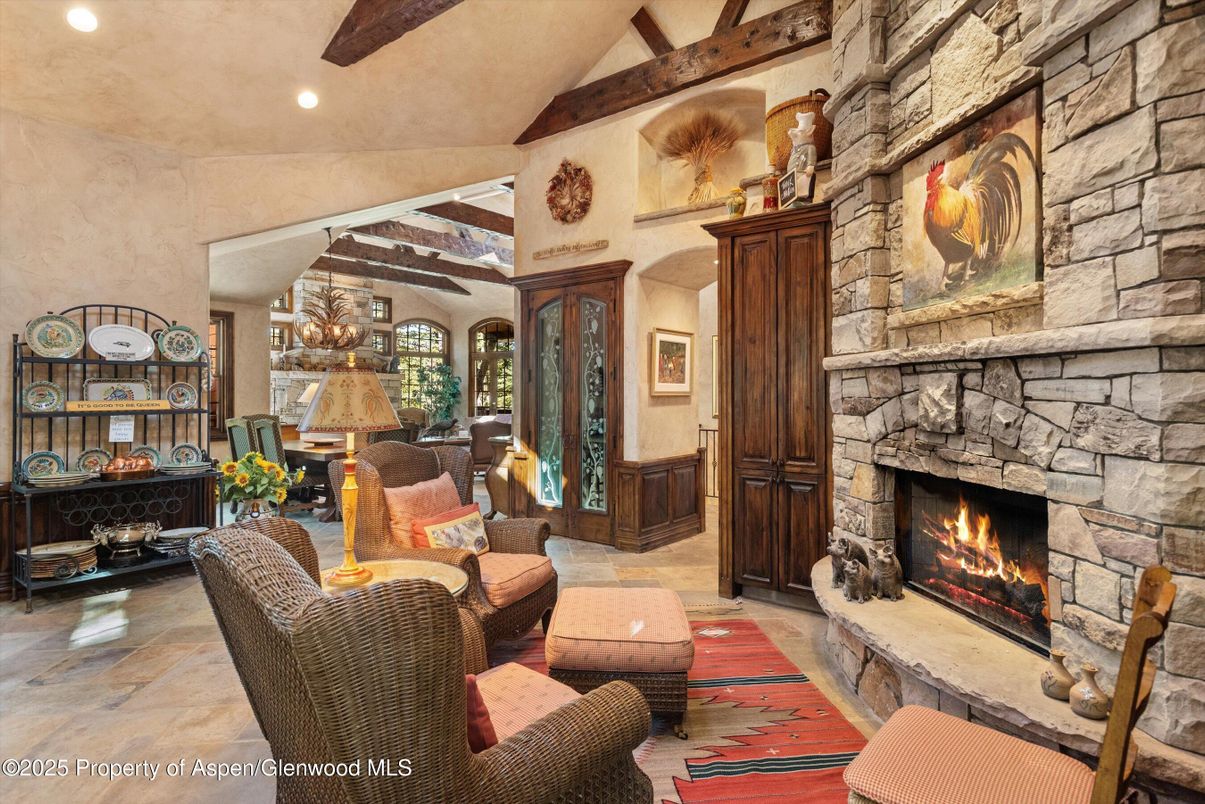 Chandelier, Fireplace, Interior, Living room, Recessed Lighting, Stone Walls, Wooden Beams