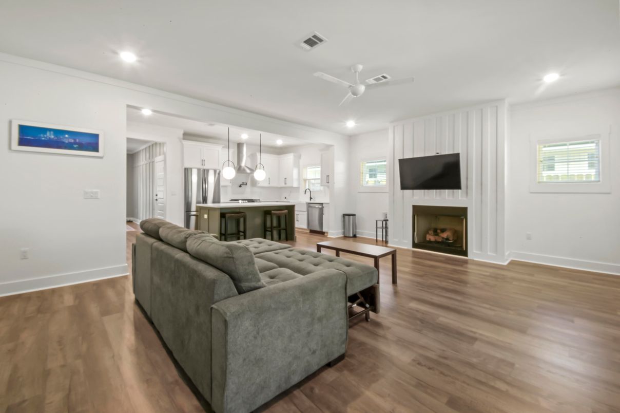 Fireplace, Interior, Kitchen, Living room, Pendant Lights, Recessed Lighting, Stainless Steel Appliances, Wood Texture Flooring